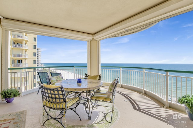 balcony featuring a water view