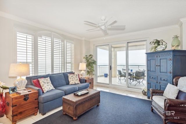 living area with ornamental molding, a ceiling fan, and tile patterned floors