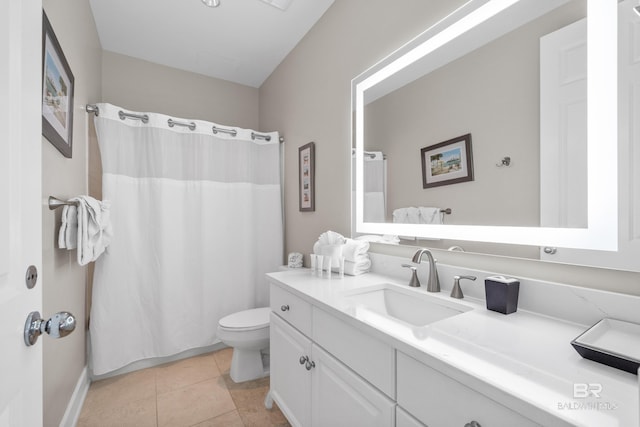 full bathroom featuring tile patterned floors, a shower with curtain, toilet, and vanity