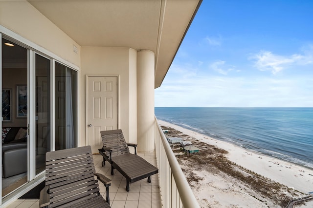 balcony with a view of the beach and a water view