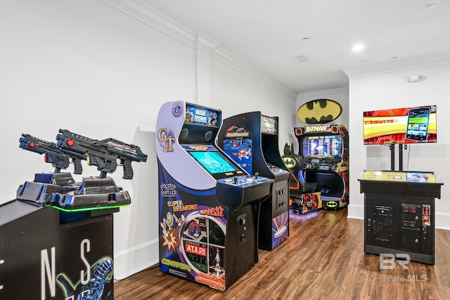 game room featuring baseboards, wood finished floors, and crown molding