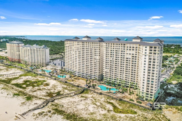 birds eye view of property with a water view