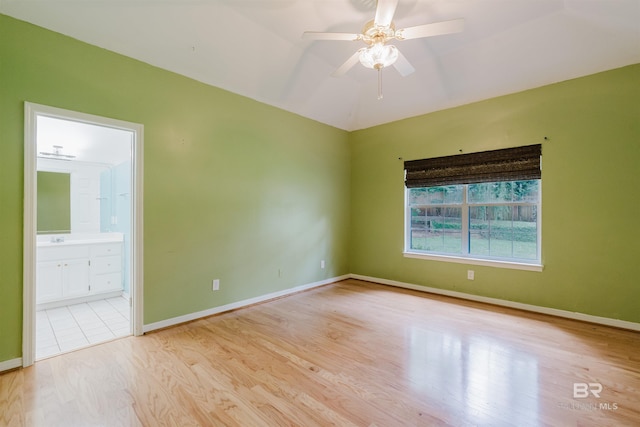 19711 Hunters Loop, Fairhope, AL 36532 - empty room with wood finished floors, a ceiling fan, baseboards, and a sink