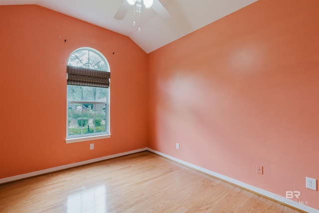 19711 Hunters Loop, Fairhope, AL 36532 - unfurnished room featuring vaulted ceiling, wood finished floors, a ceiling fan, and baseboards