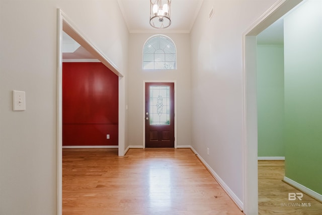 19711 Hunters Loop, Fairhope, AL 36532 - foyer entrance featuring a chandelier, wood finished floors, crown molding, and baseboards