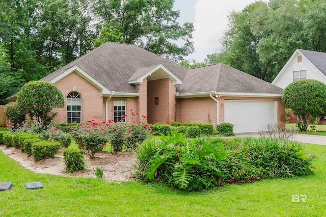 19711 Hunters Loop, Fairhope, AL 36532 - view of front of property with brick siding, a garage, a front yard, roof with shingles, and driveway