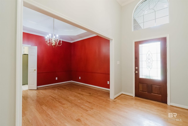 19711 Hunters Loop, Fairhope, AL 36532 - entryway with a chandelier, light wood finished floors, ornamental molding, and baseboards