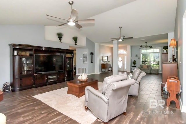 living area with visible vents, a ceiling fan, dark wood-style flooring, and vaulted ceiling