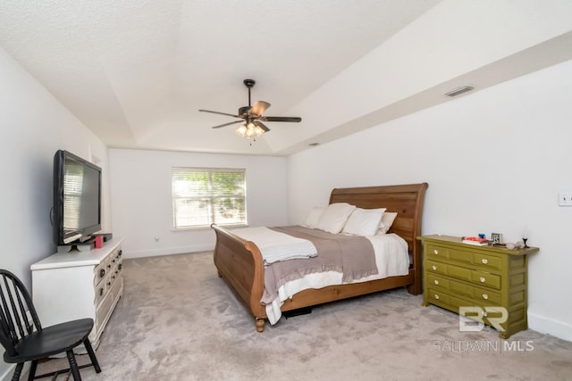 bedroom with a ceiling fan, visible vents, light carpet, and baseboards