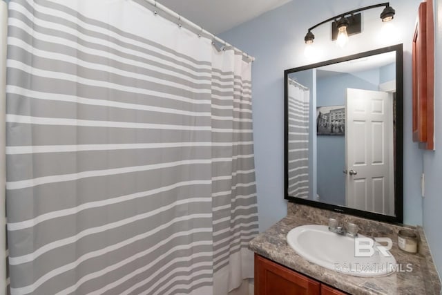 bathroom featuring vanity and a shower with curtain