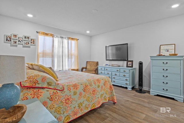 bedroom featuring light wood-type flooring