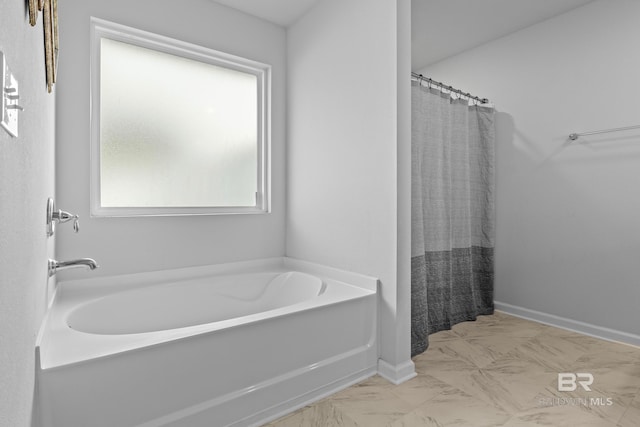 bathroom with separate shower and tub