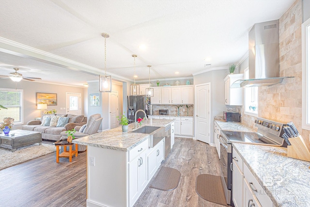 kitchen with white cabinets, stainless steel appliances, wood-type flooring, exhaust hood, and a center island with sink