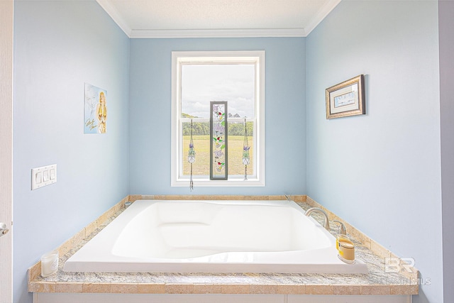 bathroom with a tub to relax in, ornamental molding, and a textured ceiling