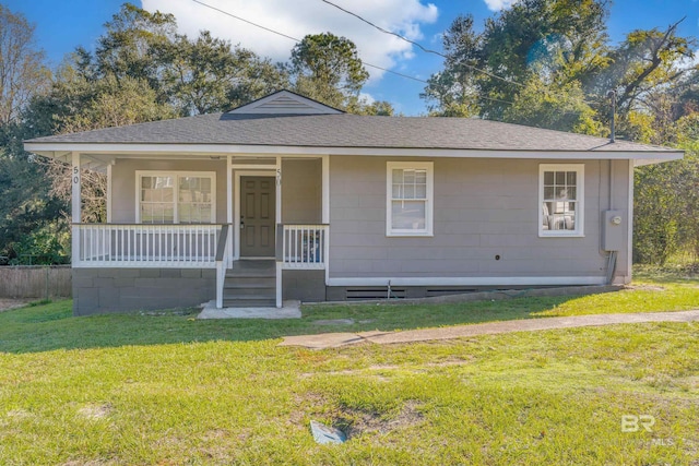 view of front of home with a front yard and covered porch