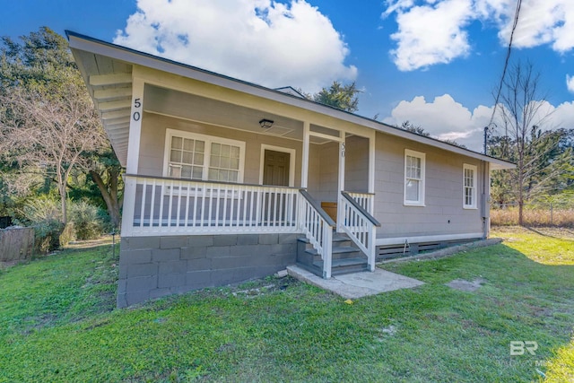 view of front of house featuring a front lawn and covered porch