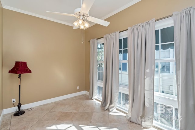 empty room featuring light tile patterned floors, ceiling fan, and crown molding