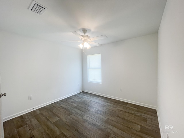 spare room featuring ceiling fan and dark hardwood / wood-style flooring