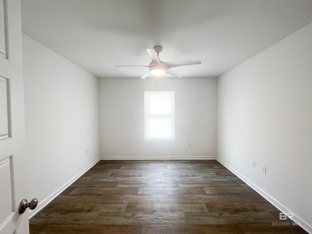 empty room featuring ceiling fan and dark hardwood / wood-style floors