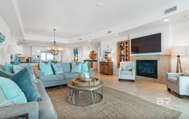 26302 Perdido Beach Blvd Unit D708, Orange Beach, AL 36561 - living room with a tiled fireplace, a chandelier, recessed lighting, and light tile patterned flooring