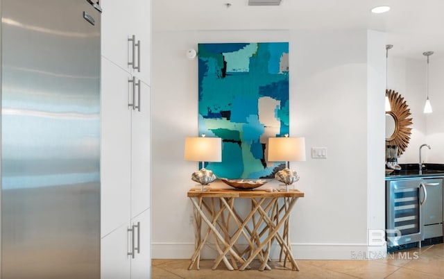 26302 Perdido Beach Blvd Unit D708, Orange Beach, AL 36561 - hallway featuring beverage cooler, tile patterned floors, and recessed lighting