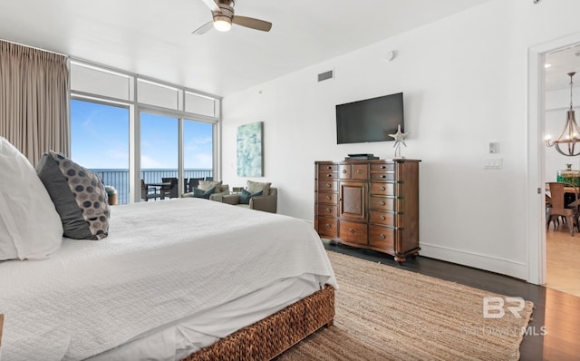 26302 Perdido Beach Blvd Unit D708, Orange Beach, AL 36561 - bedroom featuring a chandelier, wood finished floors, and ceiling fan