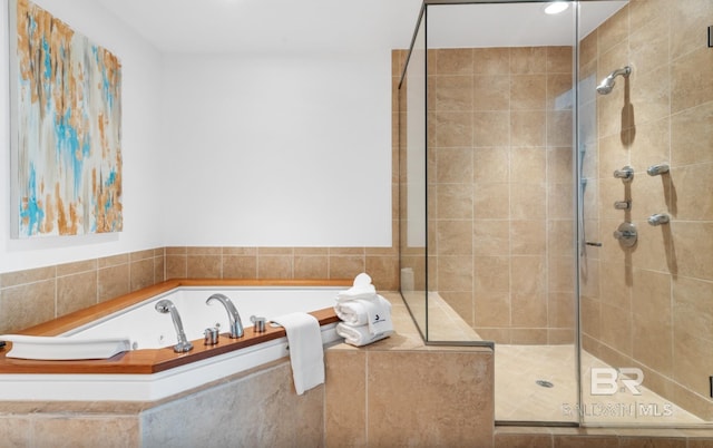 26302 Perdido Beach Blvd Unit D708, Orange Beach, AL 36561 - bathroom featuring a garden tub, a shower stall, and recessed lighting