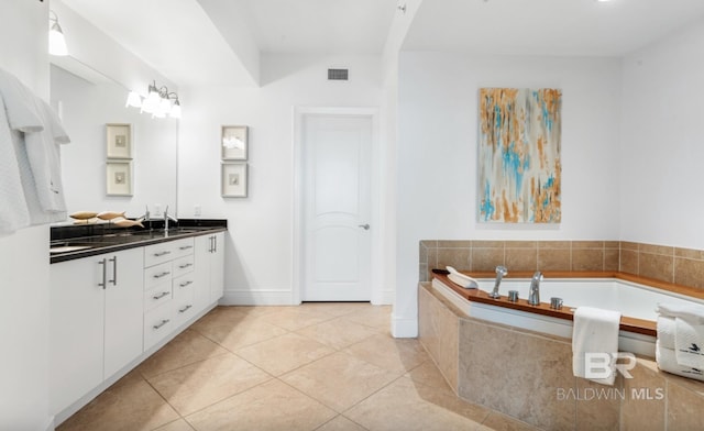 26302 Perdido Beach Blvd Unit D708, Orange Beach, AL 36561 - full bath with double vanity, a garden tub, and tile patterned floors