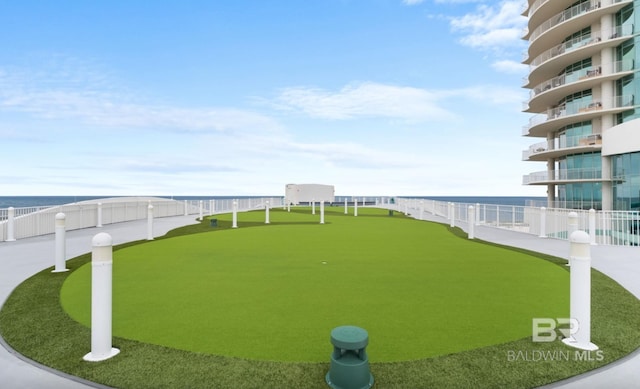 26302 Perdido Beach Blvd Unit D708, Orange Beach, AL 36561 - view of yard with a putting green and a water view