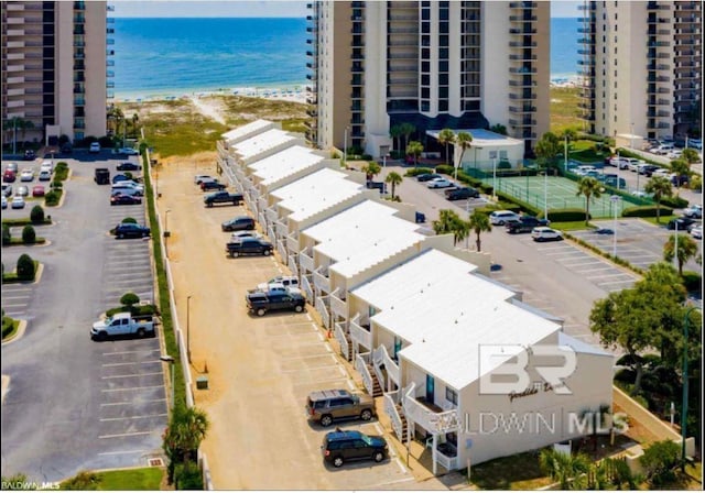 bird's eye view featuring a water view and a view of the beach