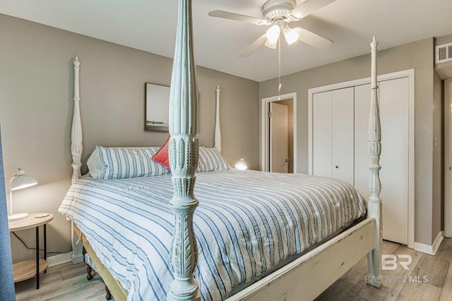 bedroom featuring a closet, ceiling fan, and light hardwood / wood-style flooring