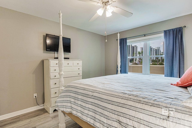 bedroom with ceiling fan and light wood-type flooring