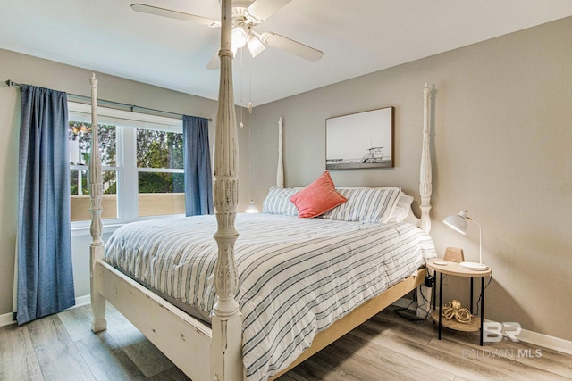 bedroom featuring hardwood / wood-style flooring and ceiling fan