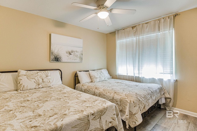 bedroom with hardwood / wood-style flooring and ceiling fan