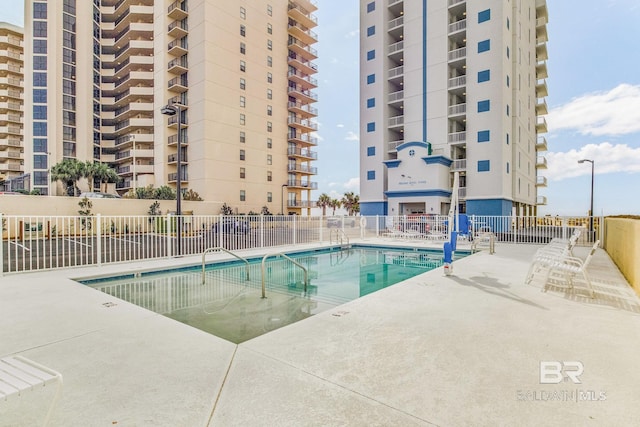 view of swimming pool with a patio