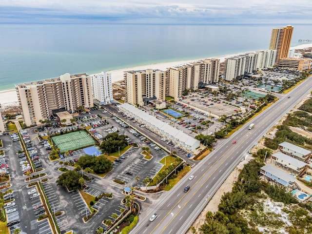 birds eye view of property featuring a view of the beach and a water view