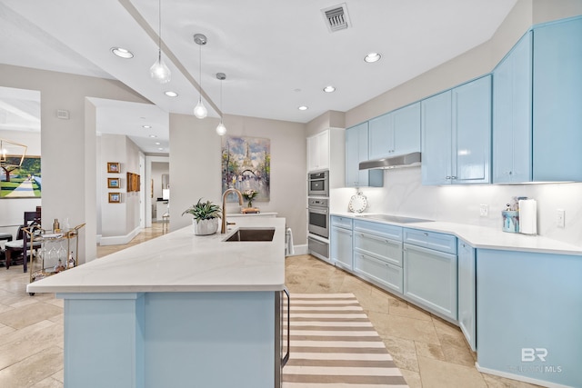 kitchen with oven, a sink, blue cabinetry, recessed lighting, and under cabinet range hood