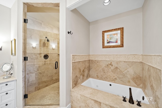 bathroom featuring a garden tub and a stall shower