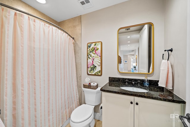 bathroom with visible vents, curtained shower, toilet, and vanity