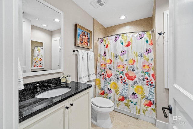 full bathroom with toilet, tile patterned floors, visible vents, and a shower with shower curtain