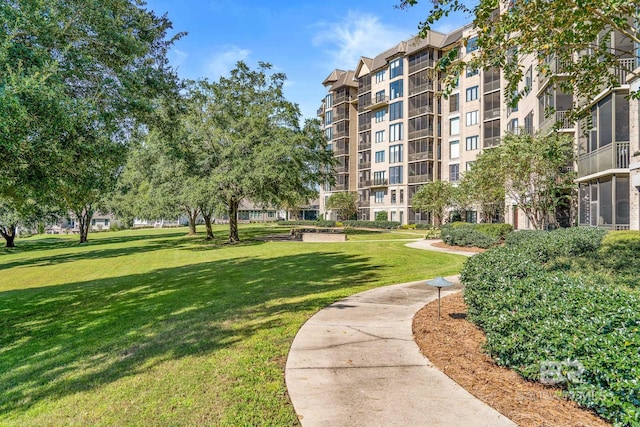 view of home's community featuring a lawn