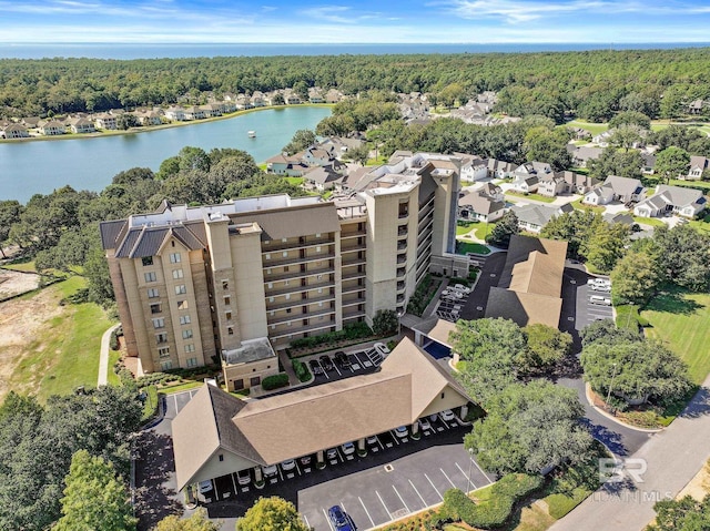 aerial view with a view of trees and a water view