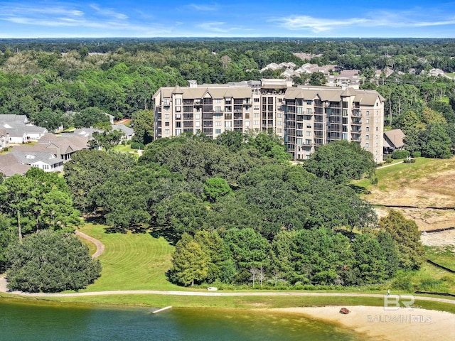 aerial view featuring a water view and a forest view