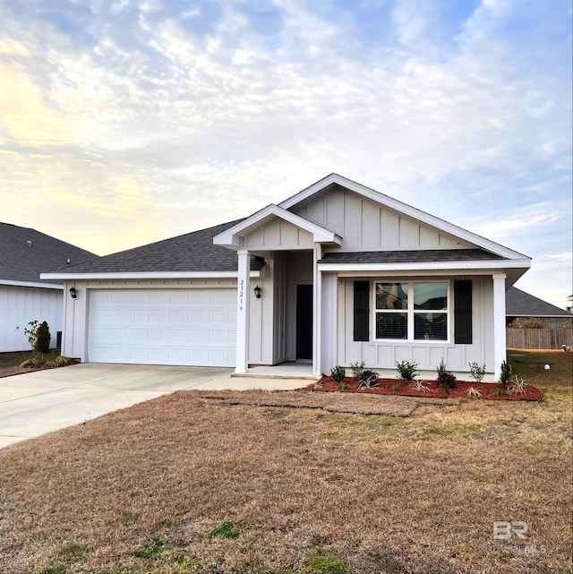 single story home featuring a garage and a lawn