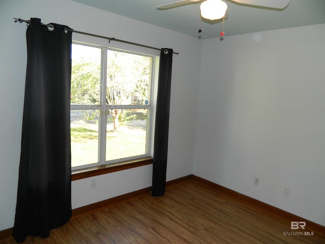 unfurnished room featuring hardwood / wood-style flooring and ceiling fan