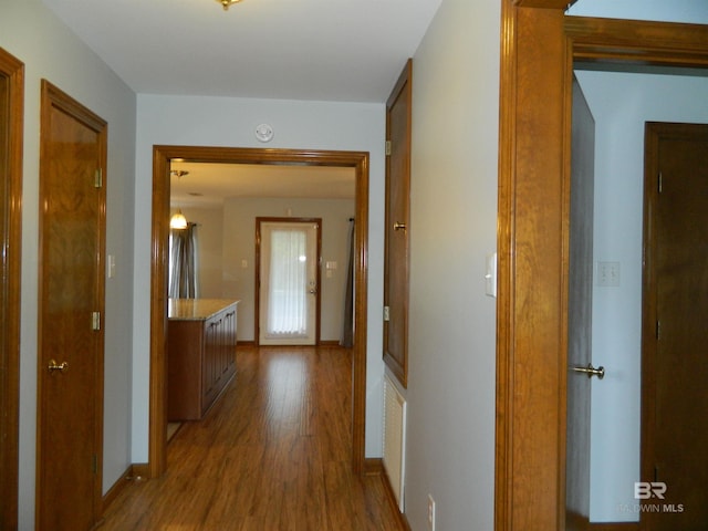 hall with light wood-type flooring