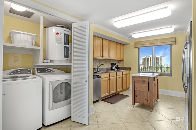 laundry room with laundry area, water heater, light tile patterned floors, and washer and dryer