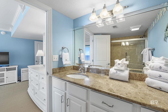 bathroom featuring a stall shower, visible vents, and vanity