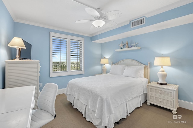 bedroom featuring baseboards, visible vents, crown molding, and carpet flooring