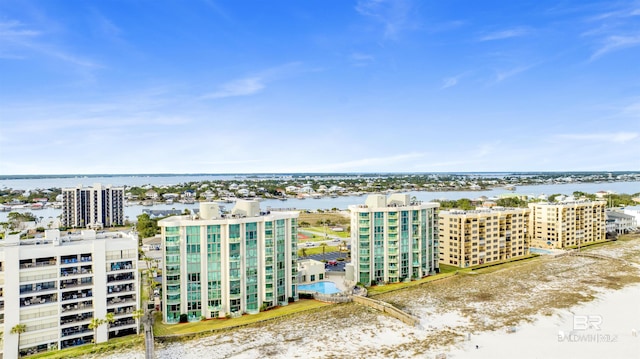 birds eye view of property featuring a water view and a city view